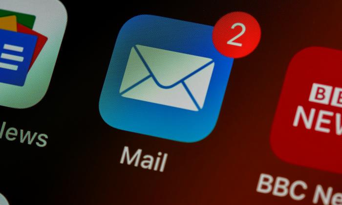 Close-up of a mail app icon on a phone screen